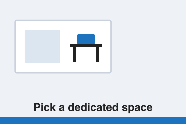 Desk with laptop, monitor and stationery